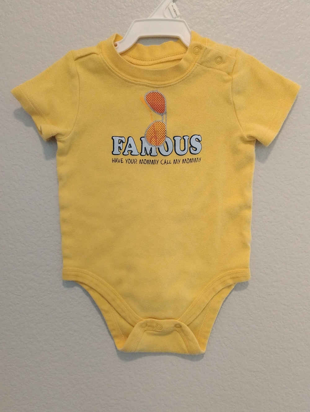 Yellow Baby Onesie With "FAMOUS, Have Your Mommy Call My Mommy" 9 Months